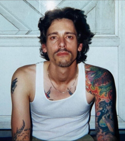 Photo of the author back in his addiction days looking unhappy.
